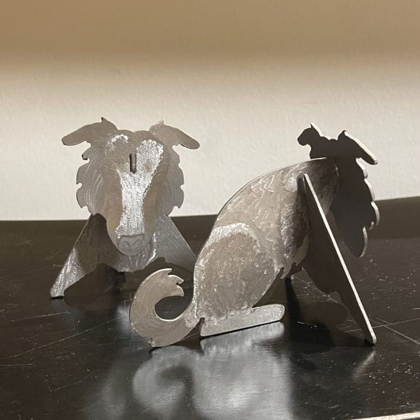 three-part metal dog sculpture